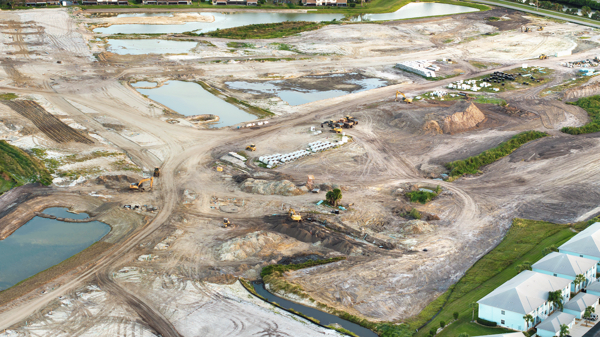 aerial-view-of-large-construction-site-with-buildi-2024-12-07-02-57-33-utc